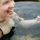 A happy lady enjoying a seaweed soak detox