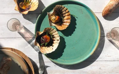 Smoky scallops in the shell with tarragon and basil butter